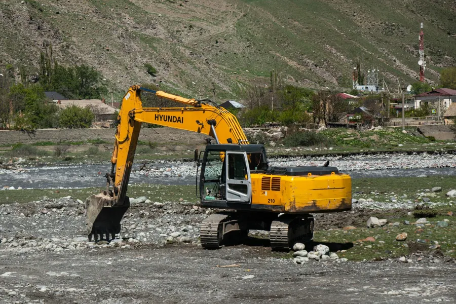 Excavator clearing up land as part of site preparation in Grandview, TN